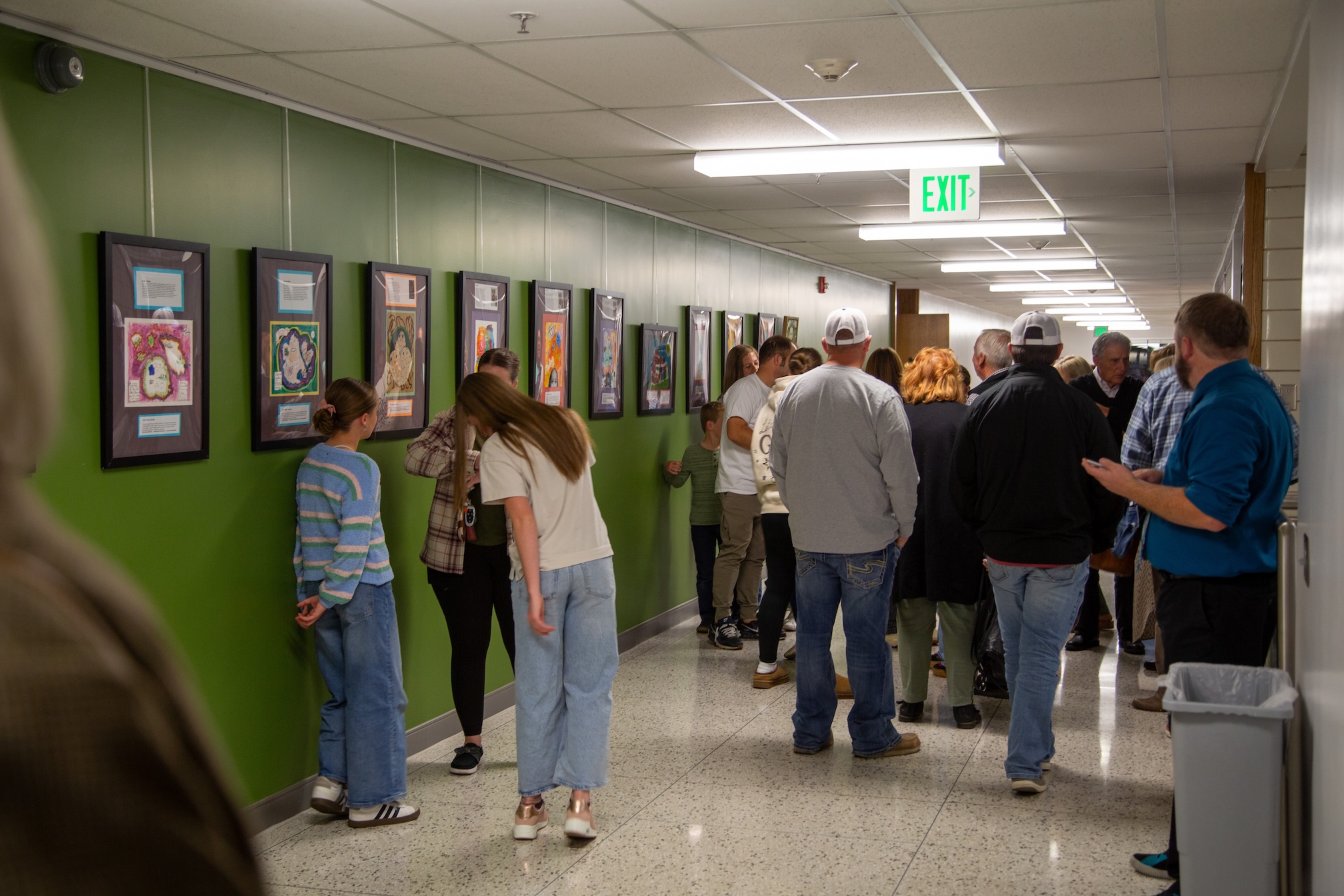 Crowd gathers at the children's art gallery.