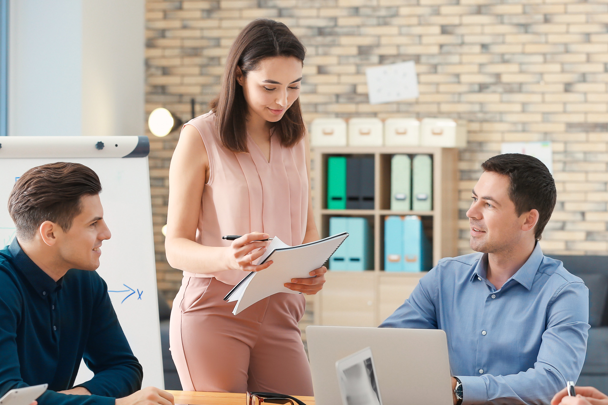 Three people in a business meeting