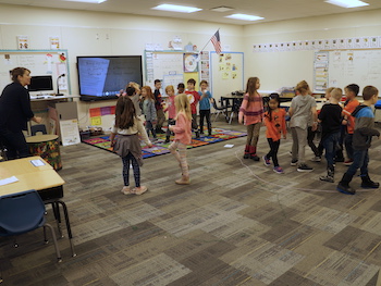 Students dancing tens and ones