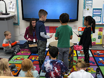 playing drum and glockenspiel