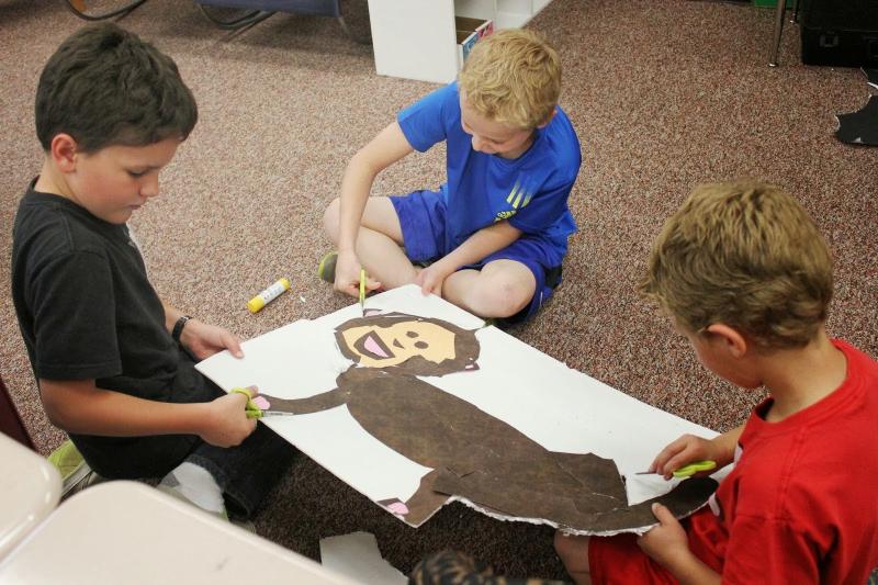 young boys work on art project