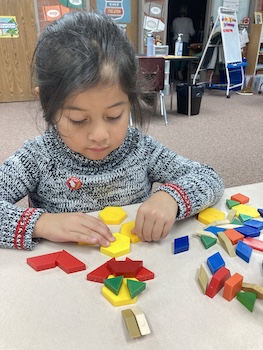 girl with pattern blocks