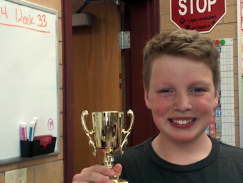 Student holding trophy