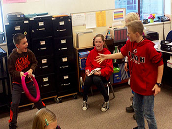 Students using basketball prop