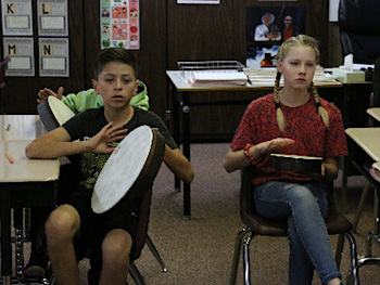 Students drumming the beat