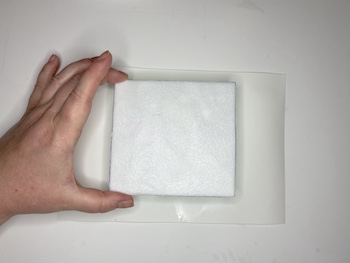 Place Styrofoam on wet paper.