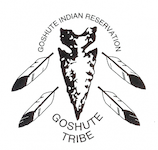 An arrowhead pointing down with two feathers on either side pointing down diagonally with the words Goshute Indian Reservation arching over the top and Goshute Tribe curving underneath.