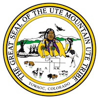 Round seal with a Native American Man in the center in front of green mountains, with tipis on the left of him, and animals (including bison, cattle, horses, and birds) below him. The words, The Great Seal of the Ute Mountain Ute Tribe surround the circle.