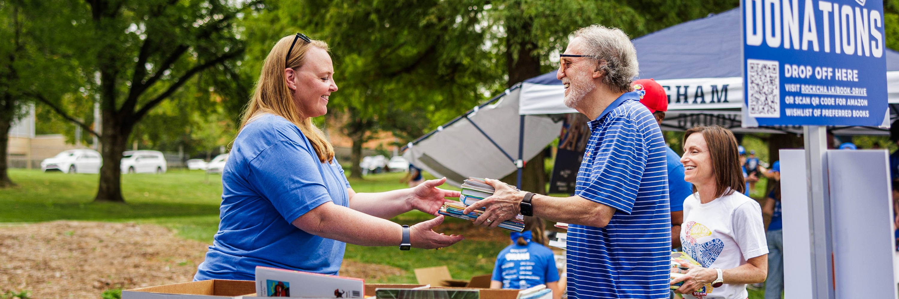 Book donation booth at an outdoor event.