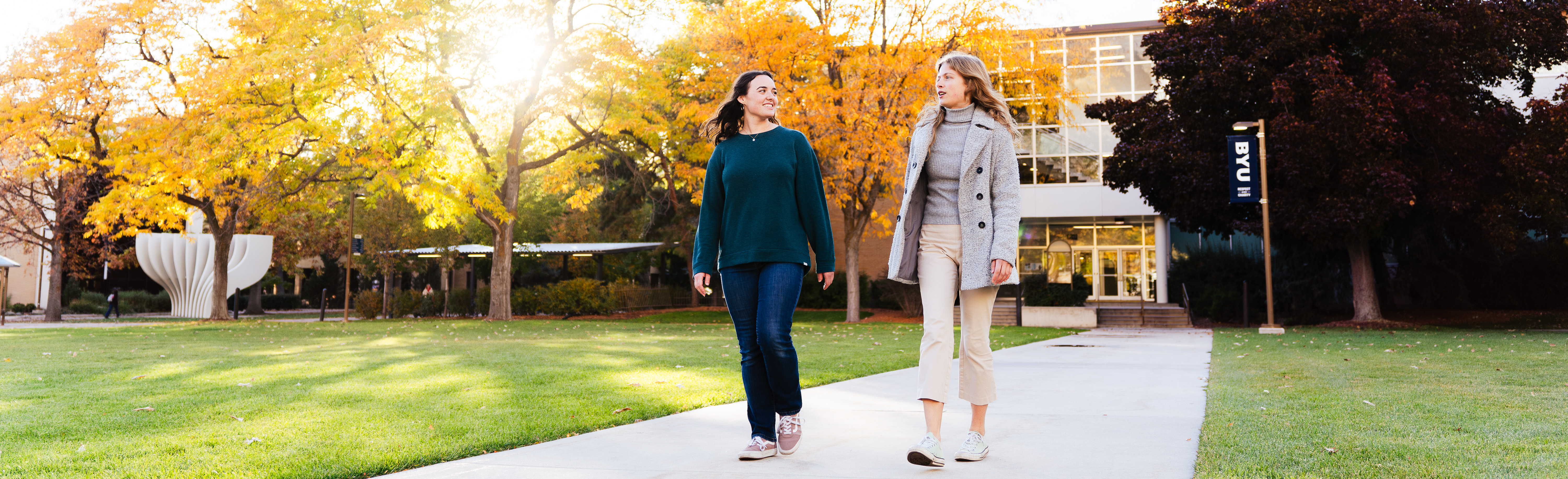 Two students walking on BYU campus