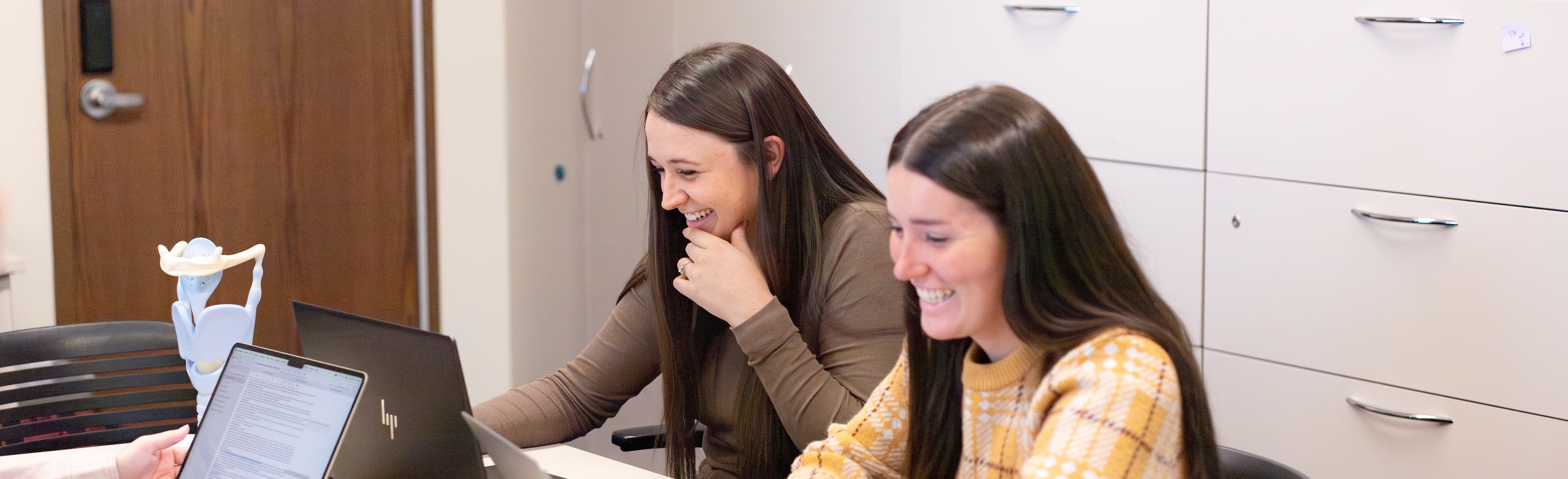 A group of students working together on computers