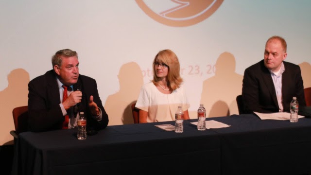 Three people at a panel