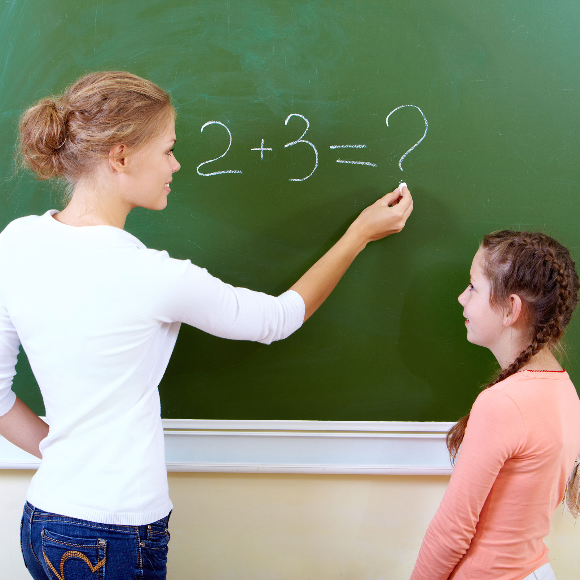 Teacher teaching girl addition
