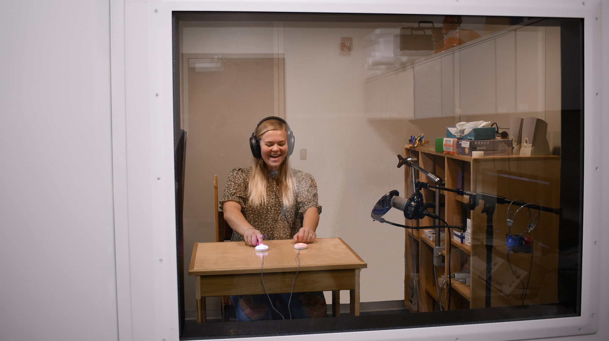 woman in audio testing booth
