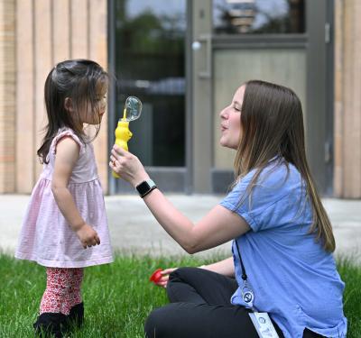 a woman playing with a child