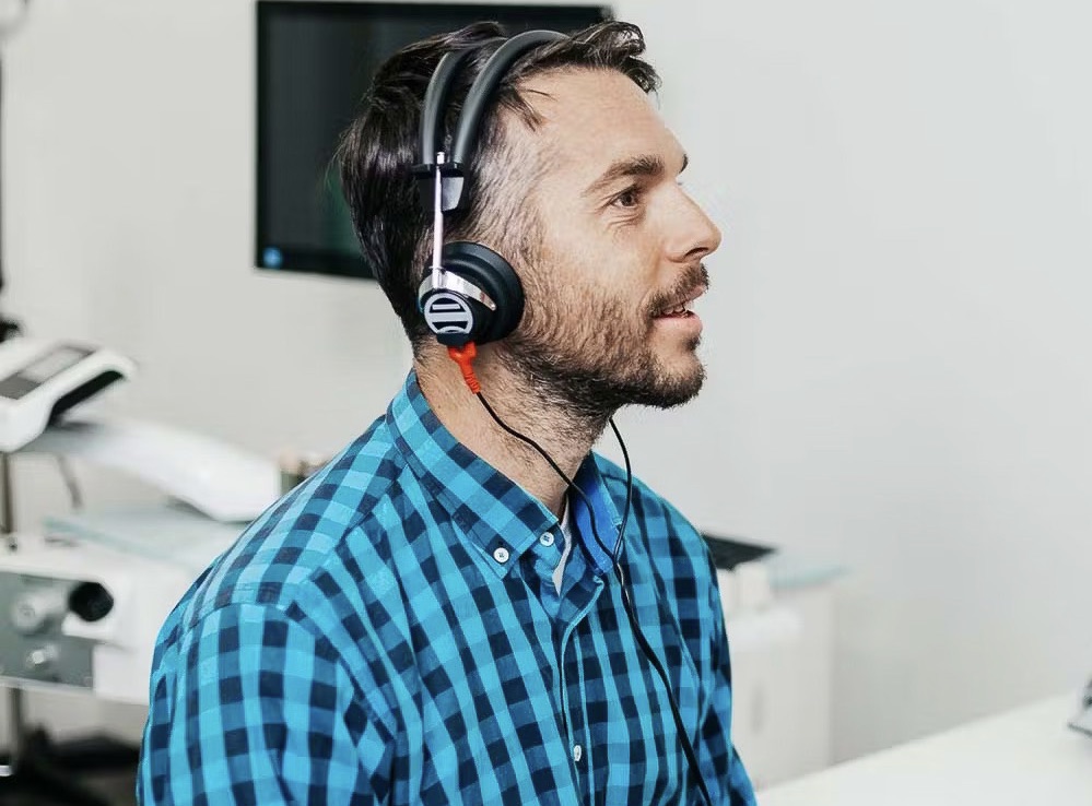 Man sitting wearing headphones