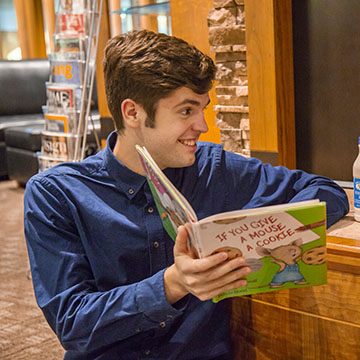 Man reading a childrens book