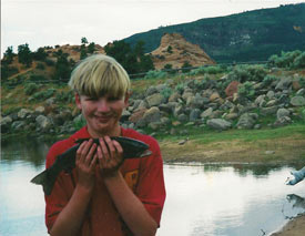 boy holding a fish