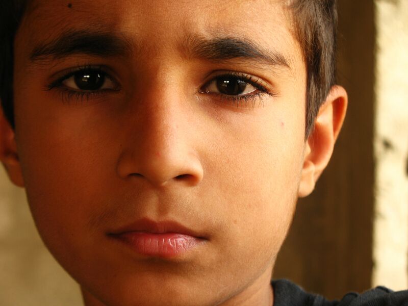 boy staring with neutral expression