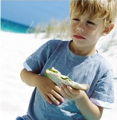 boy holding a sandwich