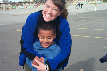 woman hugging a boy