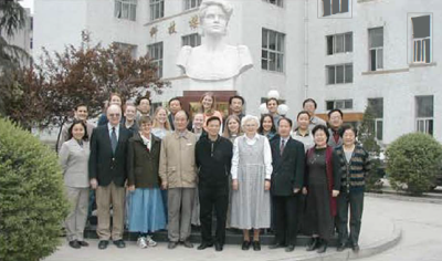 People in front of statue
