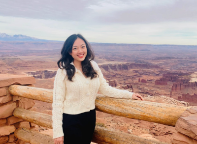 Angel Huan standing in front of picturesque background