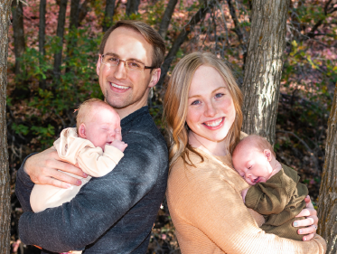 Brenna Scaden with her husband, holding their kids