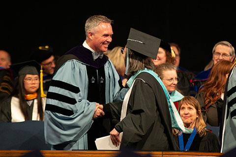 Graduate receiving their diploma