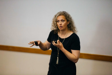woman presenting to a class