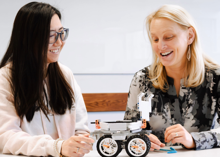 Student and teacher working on LEGO robot