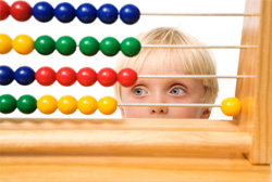 boy looking at an abacus