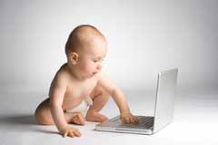 baby using laptop computer