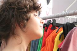 girl looking at clothes rack