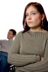 upset woman looking away from man