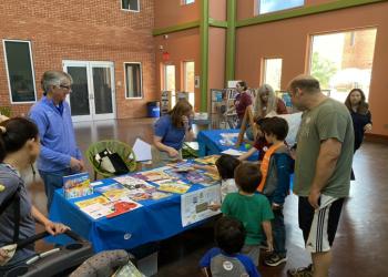 Gary and others at literacy fair booth