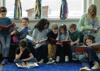 Group reading on a couch