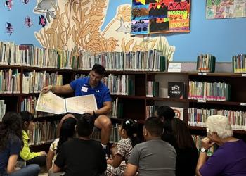 Children Listening to a Book Being Read