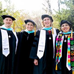 graduates standing shoulder to shoulder