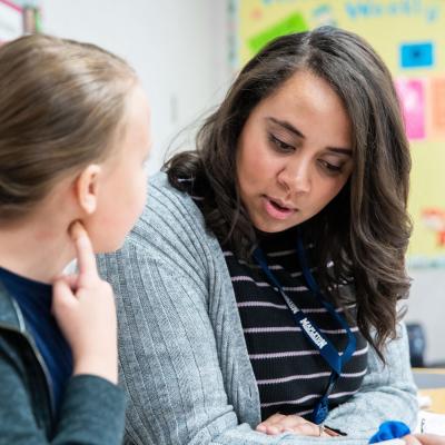 Teacher teaching a student