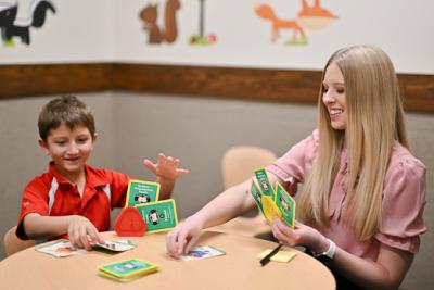 A woman playing with a child