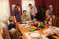 family preparing a dinner table