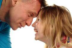man and girl looking at each closely