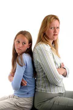 girl and woman sitting angrily by each other