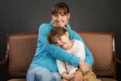 woman hugging girl