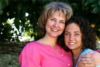 woman and girl hugging