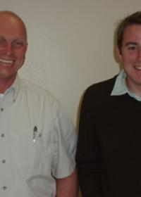 Two men smiling