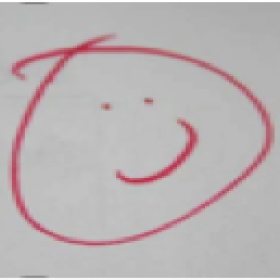 smiling face drawn with whiteboard marker